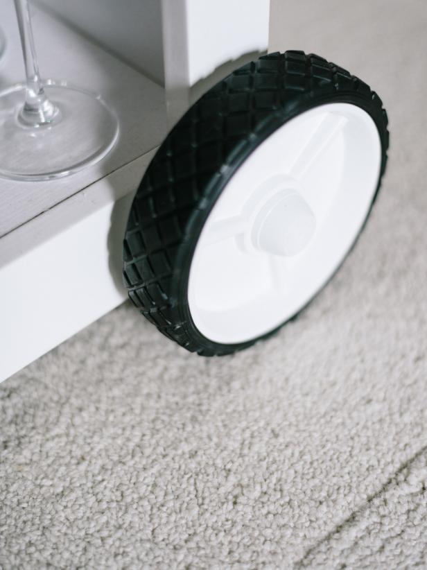 While the front casters are meant to remain concealed, the rear casters add to the overall look of the bar cart and should be visible.