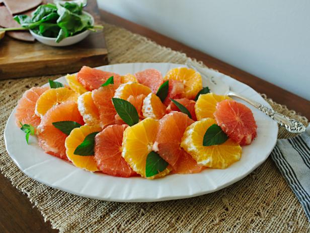 Citrus and Mint Salad Citrus Rounds With Mint on White Plate