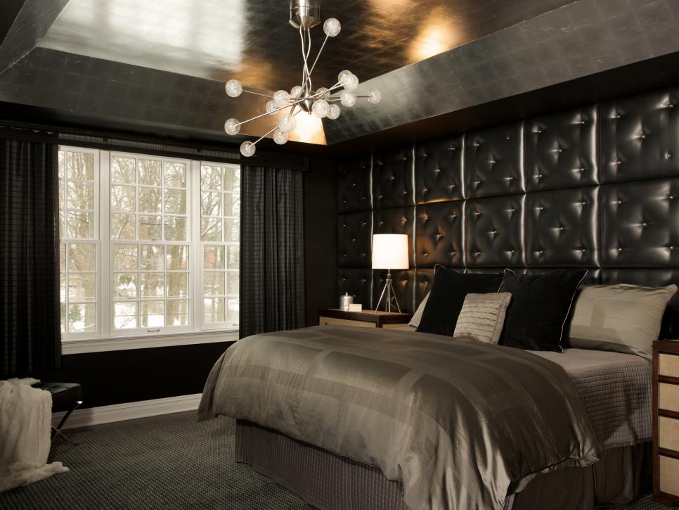 Black Bedroom With Tray Ceiling and Tufted Headboard
