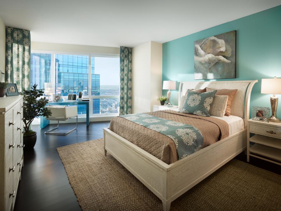 Neutral Bedroom With Light Wood Sleigh Bed and Aqua Accent Wall
