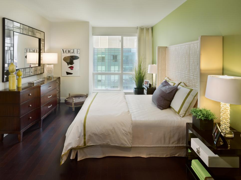 Modern Urban Bedroom With Green Focal Wall and Upholstered Headboard