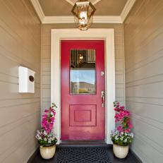 Townhouse Entryway With Red Front Door and White Molding