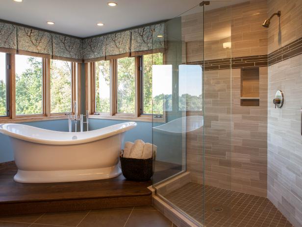 Blue Transitional Bathroom Boasts Stunning Views Spa-Like Bathroom With Freestanding Tub and Walk-In Shower