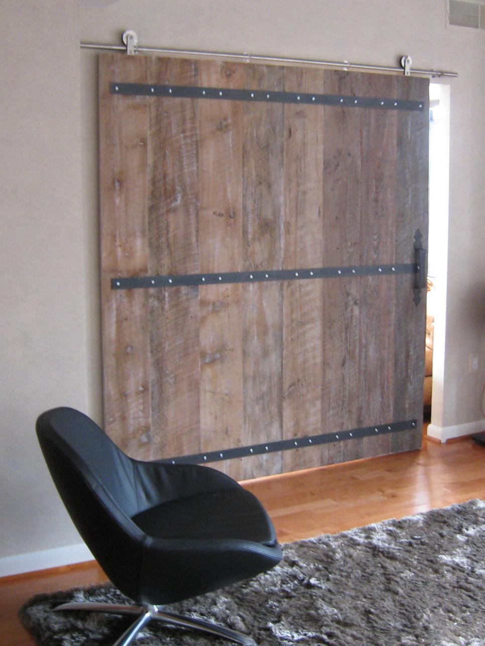 Sliding Barn Door and Black Leather Chair with Shaggy Rug