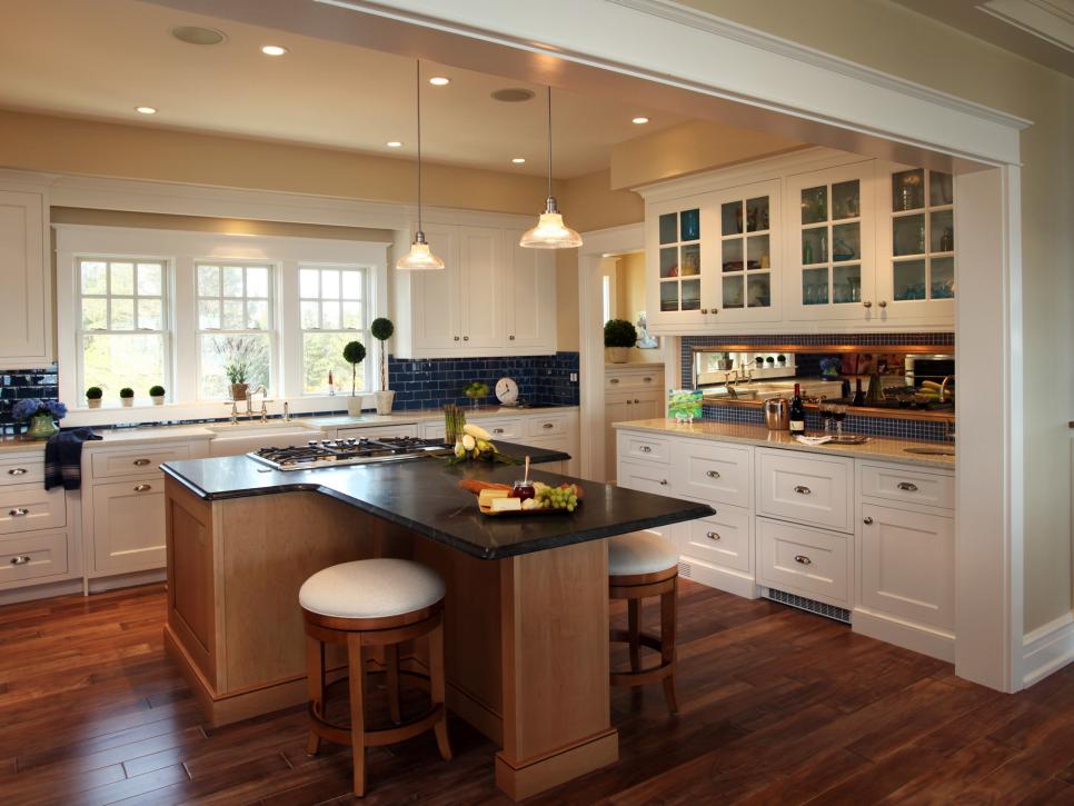 Kitchen With White Cabinets, Blue Tile Backsplash and Large Island