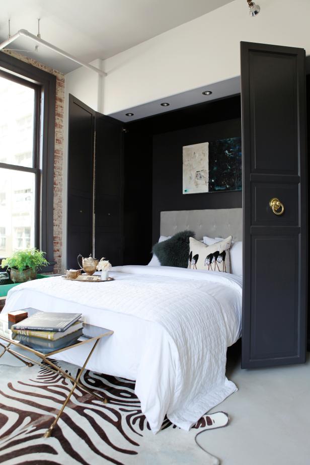 Murphy Bed in Chic, Urban Living Space White Room With Gray Bed, White Bedding and Zebra Print Rug