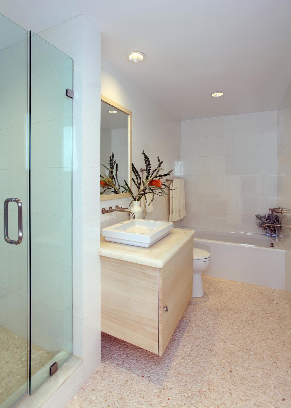 Transitional White Bathroom With Floating Wood Vanity White Bathroom With Neutral Pebble Floor