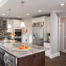 Contemporary Gray Kitchen Features Island With Built-in Appliances