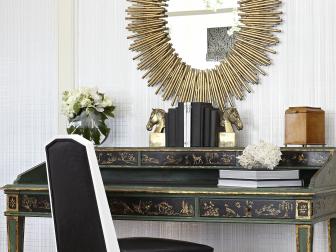 Sunburst Mirror Above Antique Writing Desk With Horse-Head Bookends