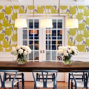 Dining Area With Yellow Floral Wall, White Chandelier and Wainscoting