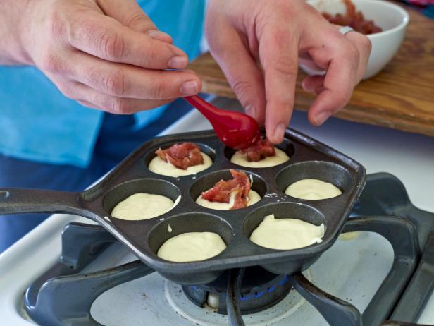 Top batter with jam to make danish doughnuts for holiday guests.