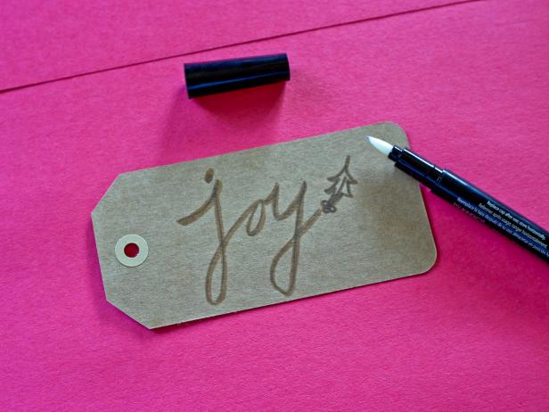 Write a holiday message on a tag to create a place card or gift tag for guests.