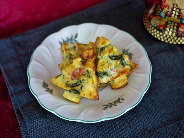 Make spinach frittatas in a Christmas tree shape as a festive, easy holiday breakfast idea for guests.