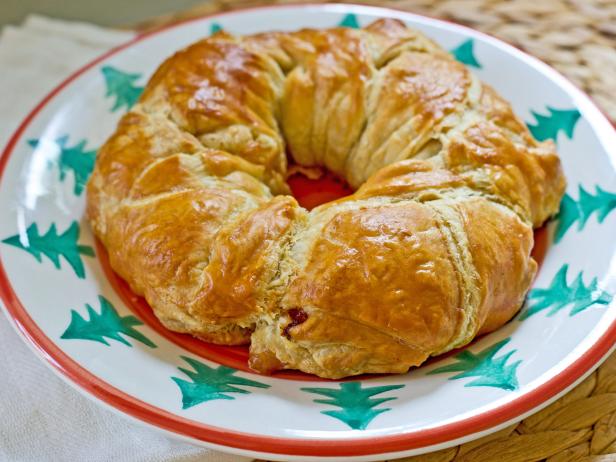 Fill pastry dough with cheese and herbs, and form it into a circle to create a holiday-inspired breakfast for overnight guests.
