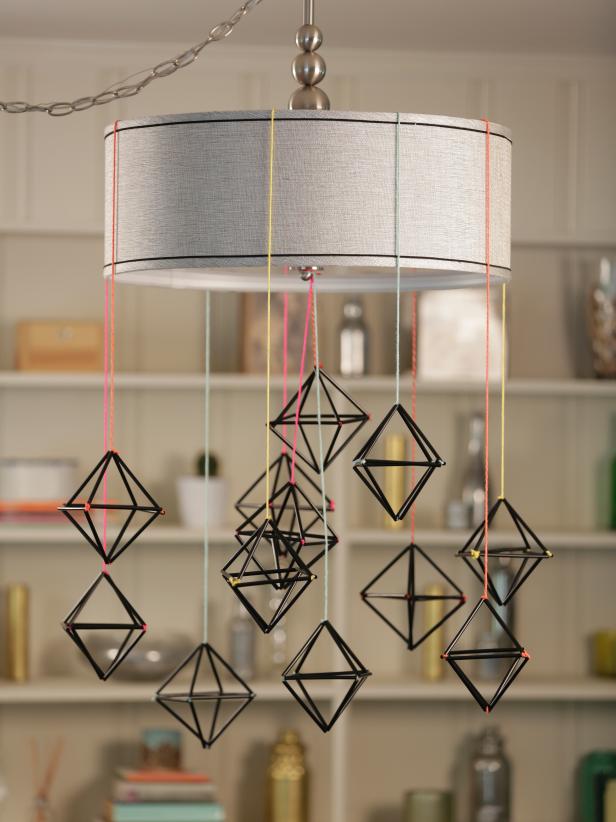 Use black plastic straws and colorful yarn to create a simpler, sturdier version of Finnish Himmeli ornaments, which are traditionally made from straw. Hang a bunch together for a modern, graphic holiday centerpiece.