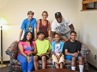 Family of Four on a Couch with LeBron, Nicole and Her Son Behind It 