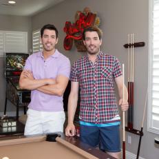 Drew and Jonathan Scott Pose in Their Game Room