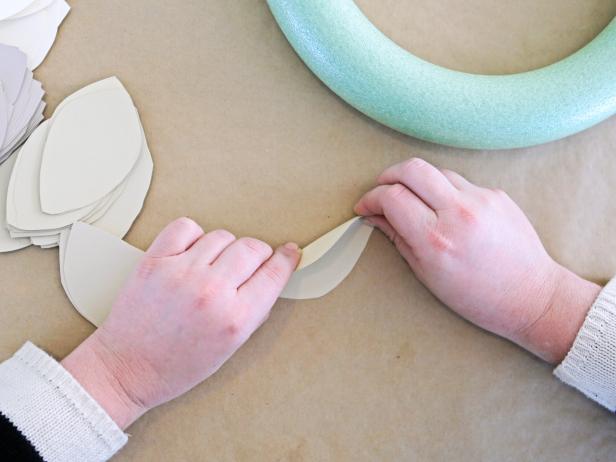 Step 3a: Fold each leaf in half lengthwise.