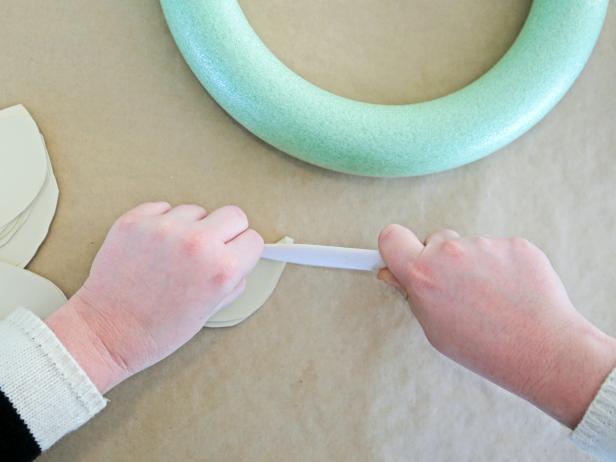 Step 3b: Use a bone folder or scissors to create a crisp crease on the folded leaf.