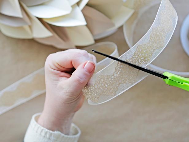 Step 8: Cut two lengths of ribbon to create a hanger.