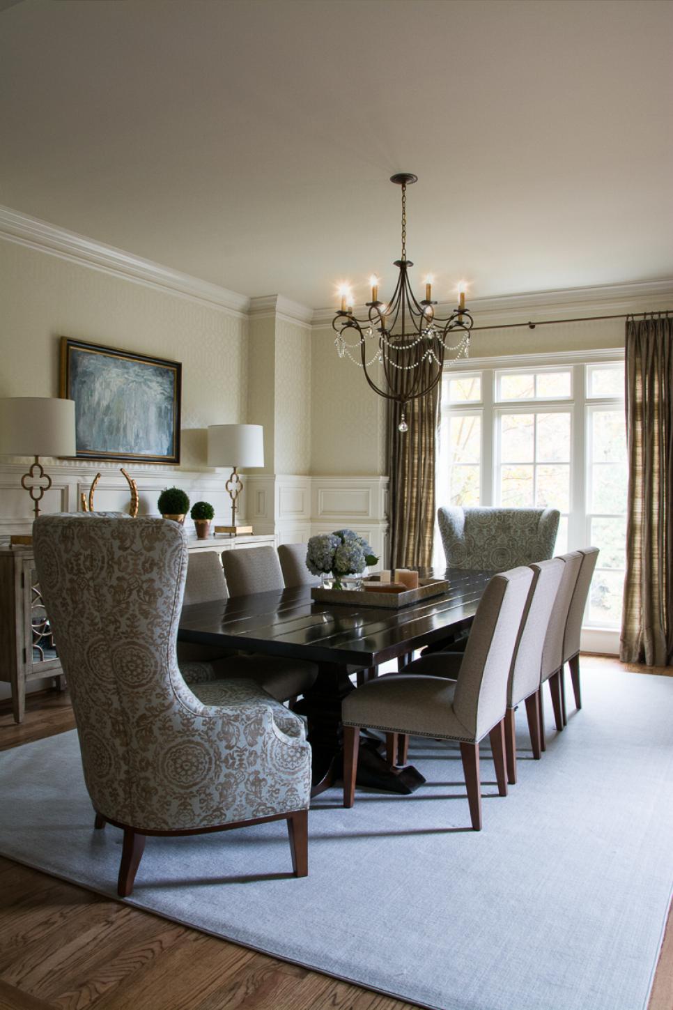 Glamorous Dining Room With Sleek, Wooden Table and Metallic Accents Neutral Transitional Dining Room With Gray and Gold Accents