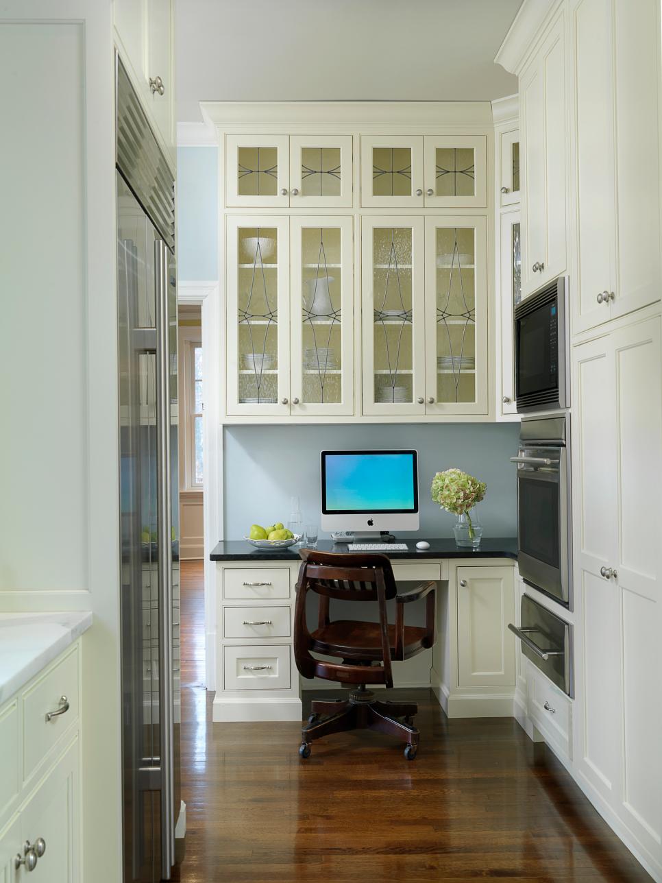 Traditional Kitchen Office Space With White Cabinets Built-In Desk With Black Countertop in Traditional White Kitchen