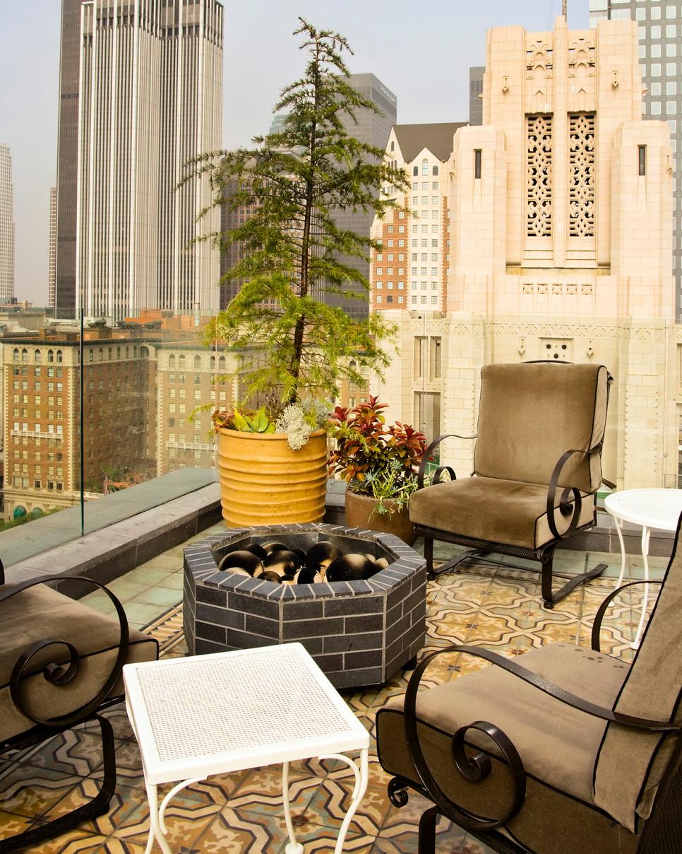 Mediterranean Restaurant Terrace With Fire Pit Neutral Restaurant Terrace With Fire Pit and Armchairs