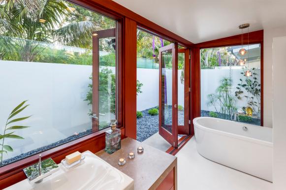 Asian Bathroom With Freestanding Tub and Patio Access