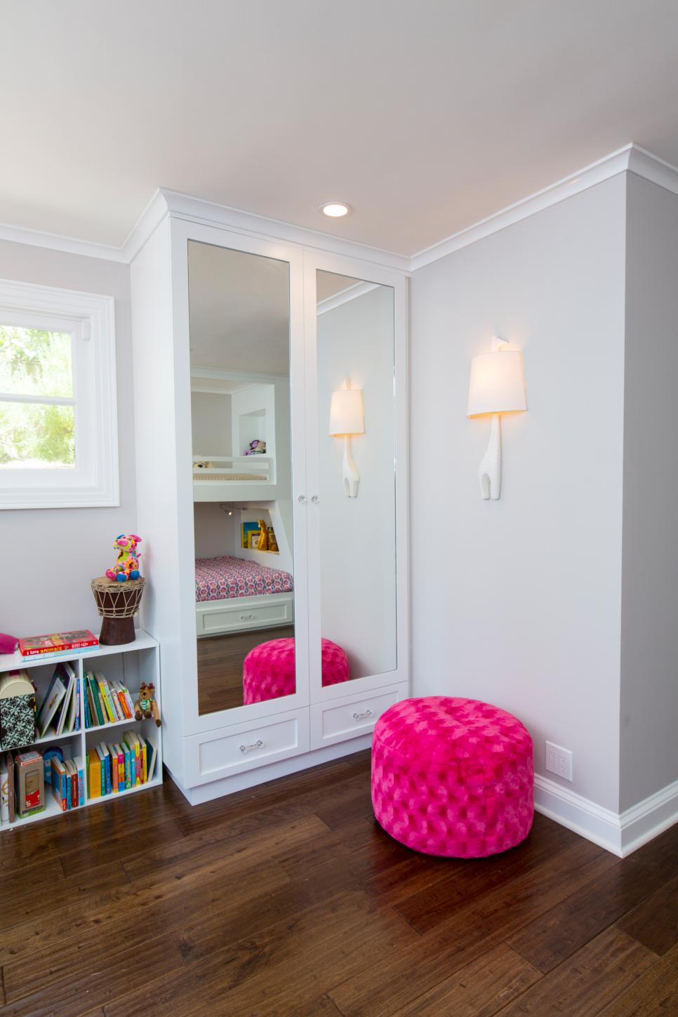 Mirrored Armoire With Task Lighting Mirrored Closet Doors With Recessed Lighting and Pink Ottoman