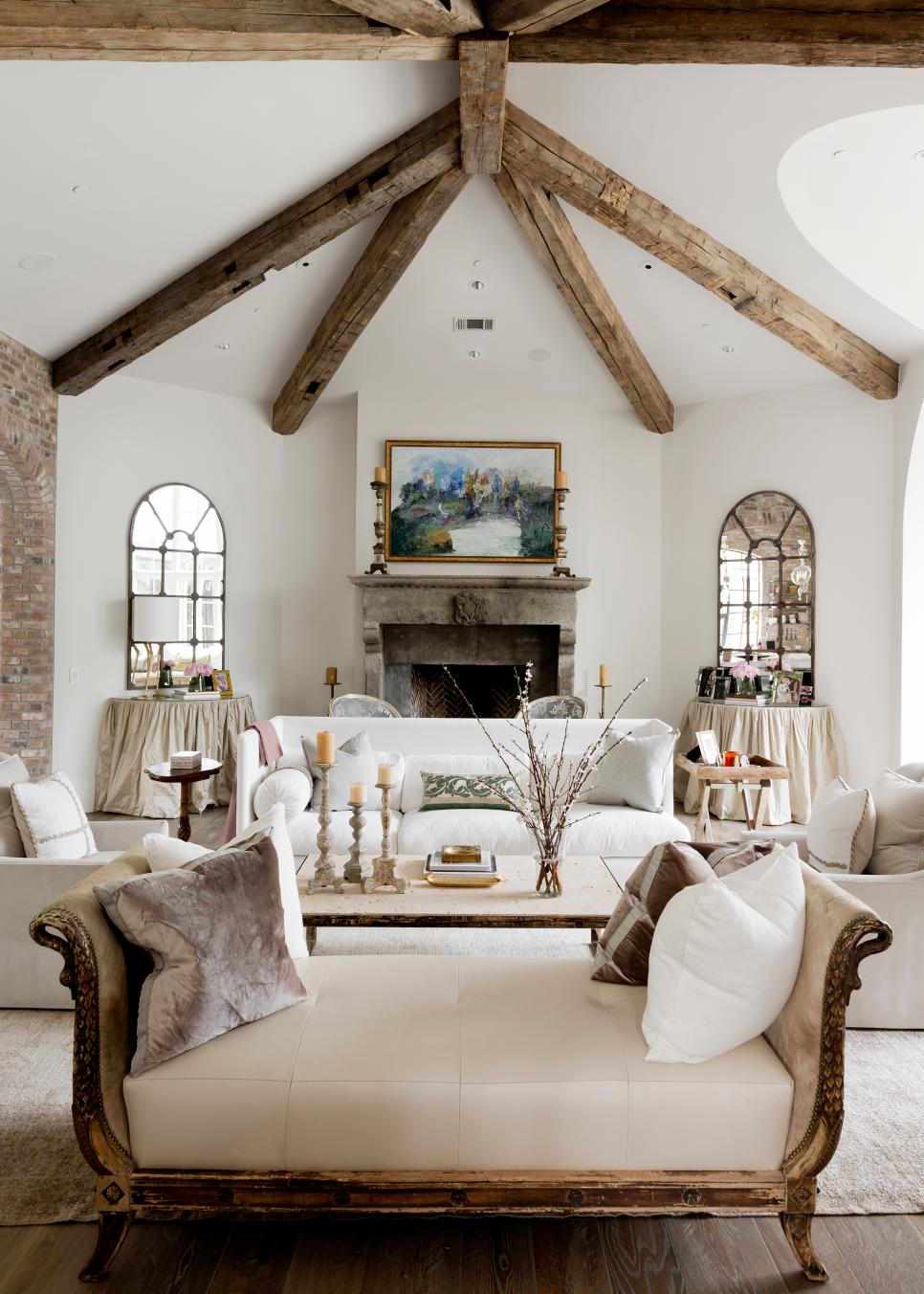 Elegant White Living Room Showcases Rustic Wood Beams Traditional White Living Room With Neutral Furniture and Wood Beams