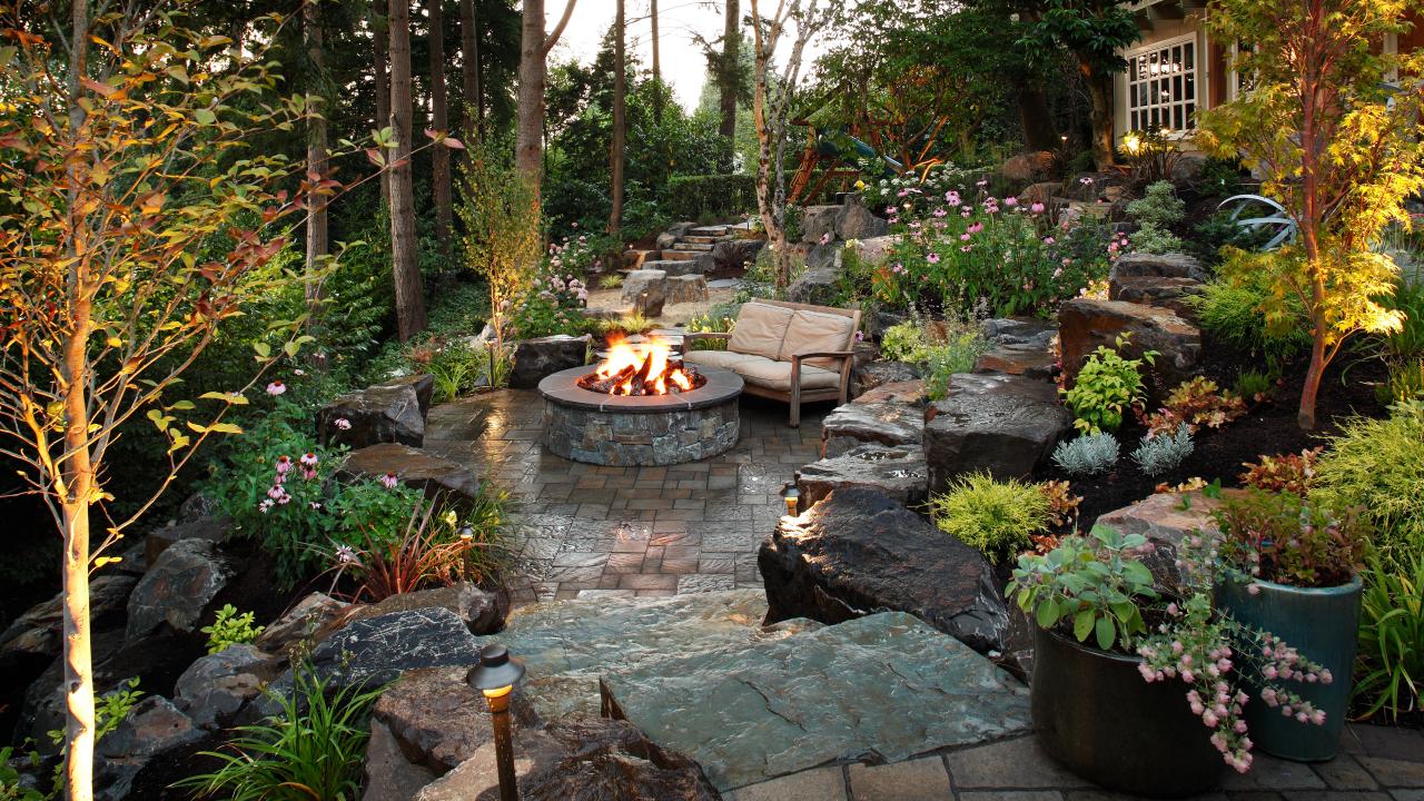 woodland backyard patio with stone fire pit this quiet backyard patio ...