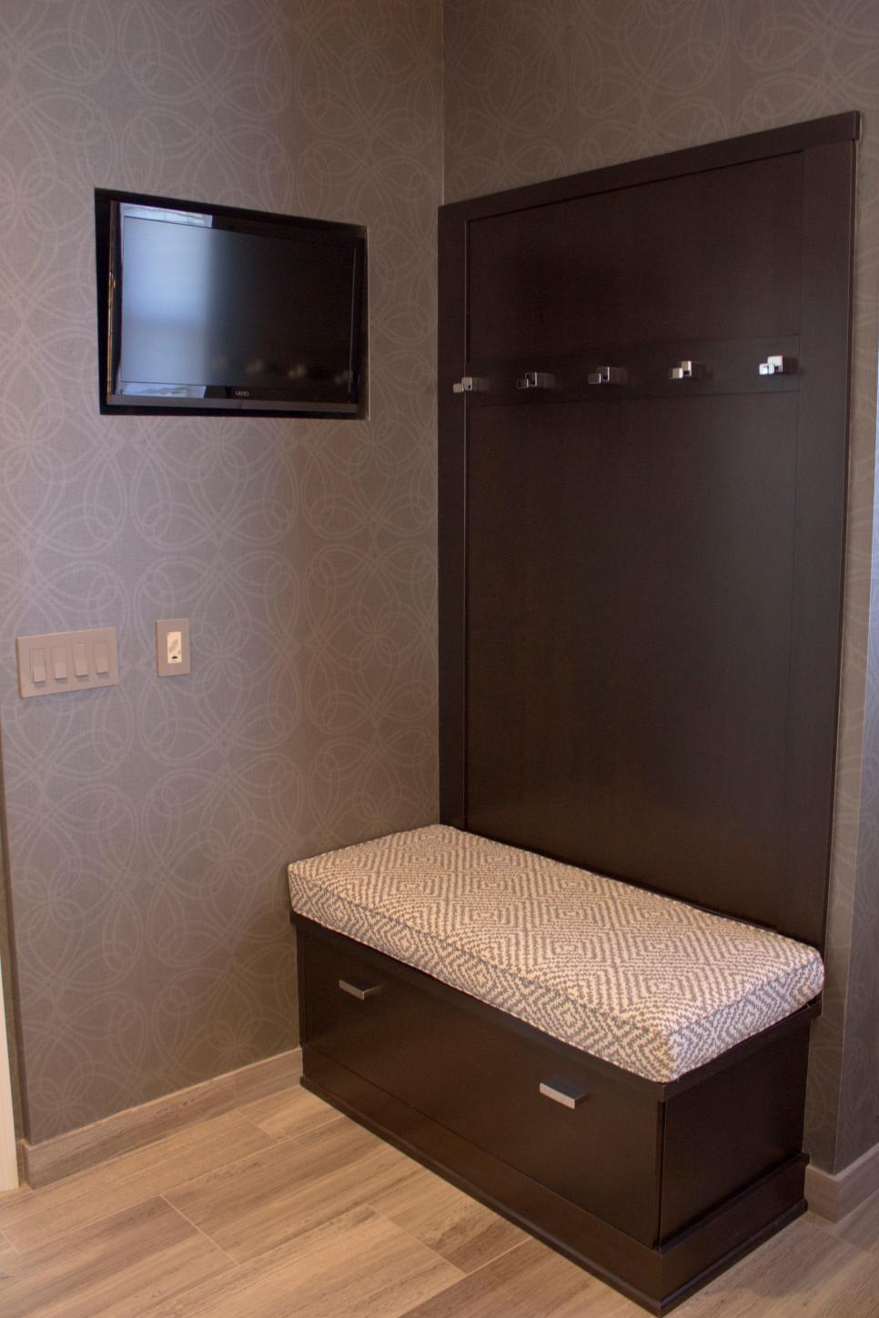 Contemporary Master Suite Features Built-In Television and Chic Coat Hooks Small Gray Space With Built-In TV, Cushioned Bench & Coat Hooks