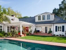 Exterior of White Two-Story Home With Pergola and Swimming Pool