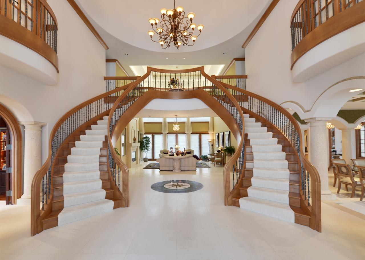 Double staircase foyer house plans