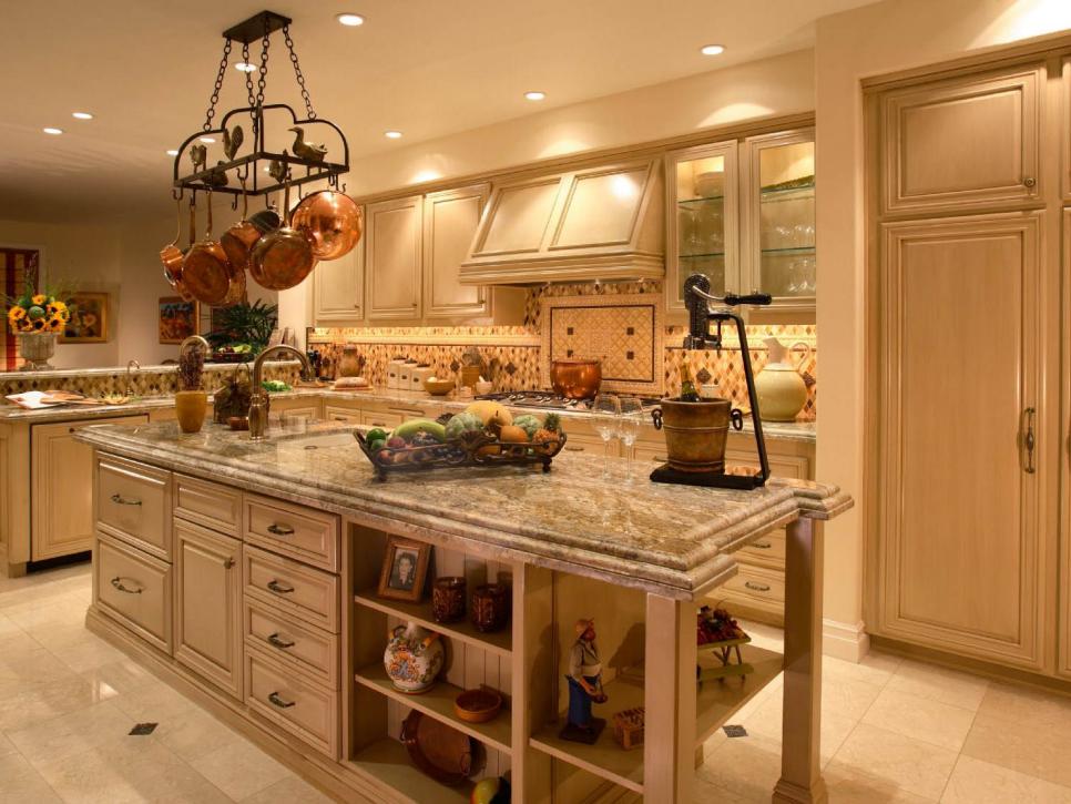 Mediterranean Kitchen With Granite Countertops and Cream Cabinets