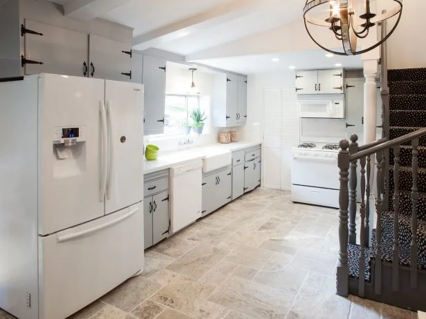 White Kitchen With Gray Cabinets, Beige Tile Floor and Dark Staircase