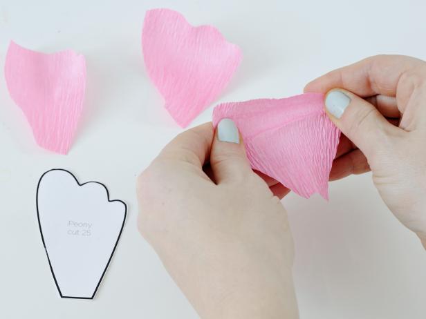 Use your fingers to stretch apart the crepe paper folds along the top of each petal to make them look more realistic.