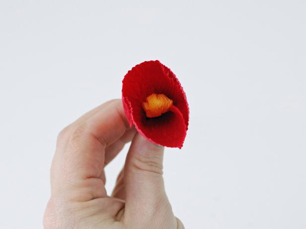 Arrange the inner petals around the stamen. Each petal should slightly overlap the one next to it.