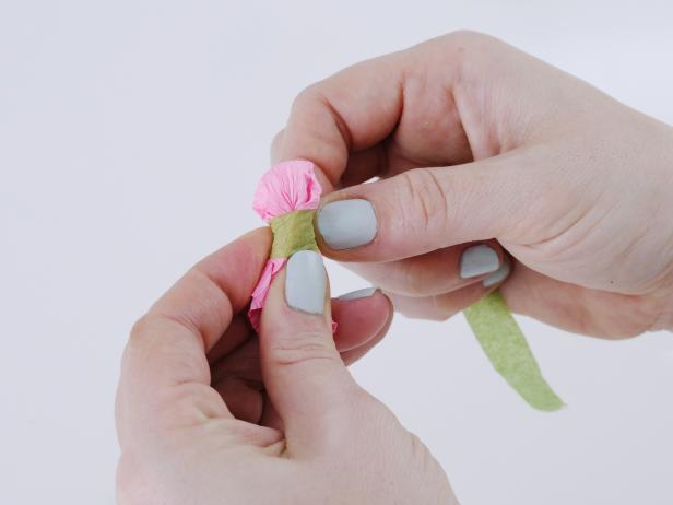 Stretch the crepe paper over the cotton ball, and secure to the wire with floral tape.