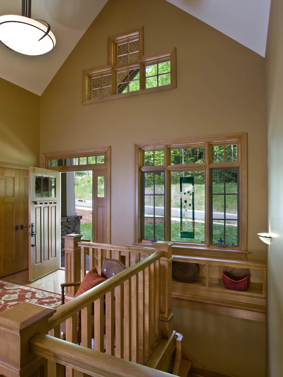 Brown Arts and Crafts Foyer With Transom Windows and Wood Molding