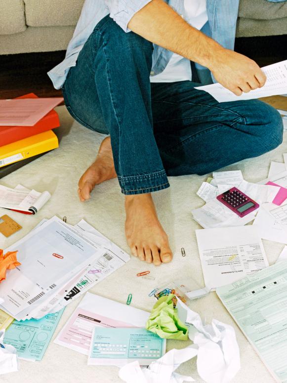 Man With Mess of Papers and Bills Man With Mess of Papers and Bills