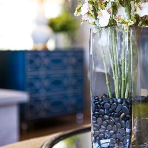 Flowers in a pebble filled vase