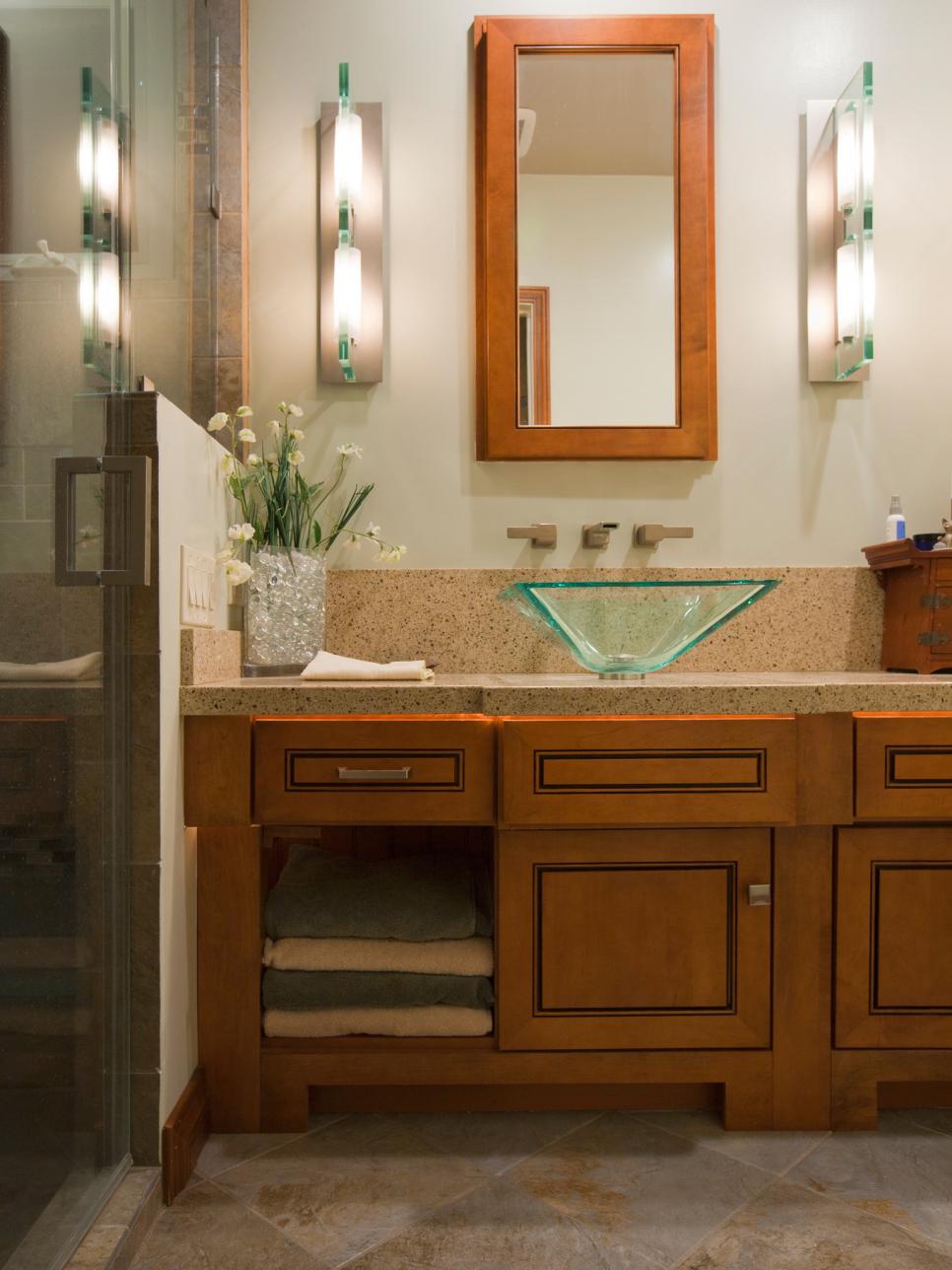 Bathroom with a Green Glass Sink and Granite Countertops