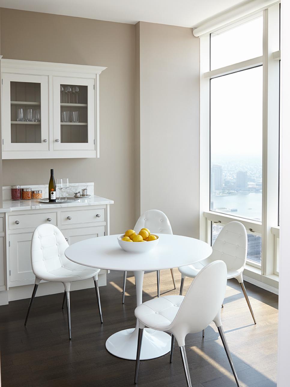 Neutral Modern Eat In Kitchen With Round Table and Large Windows