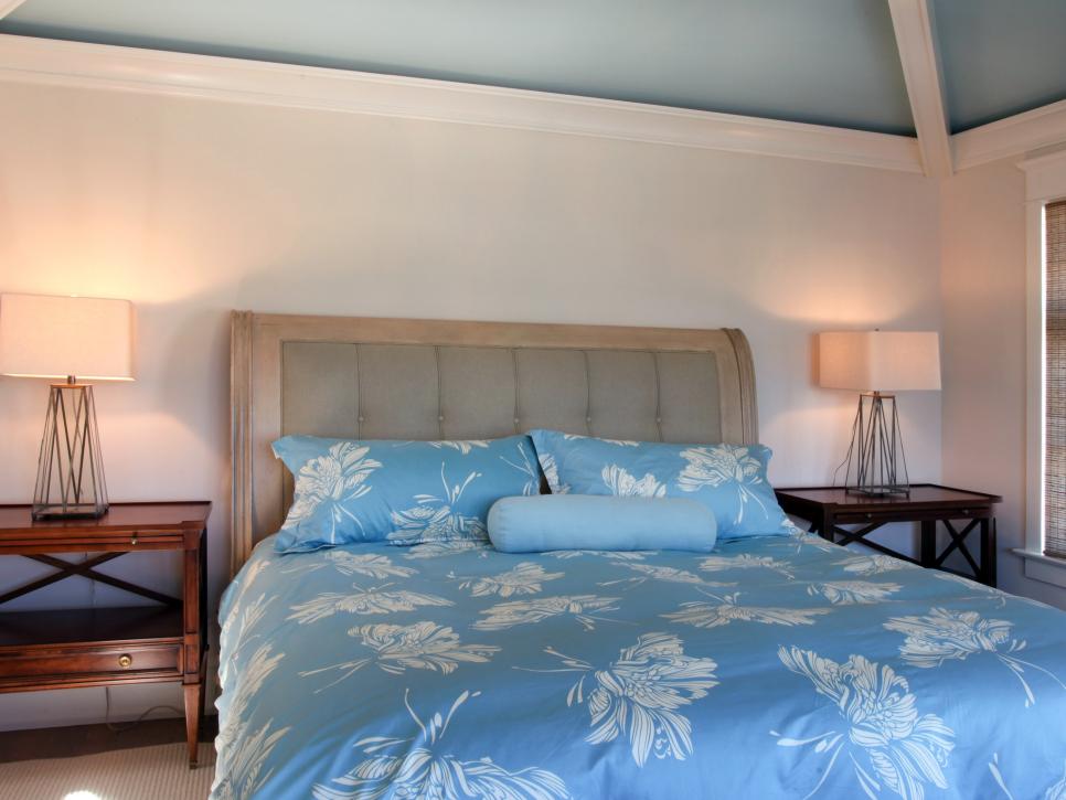 White Bedroom With Blue Ceiling and Bold Tropical Bedding