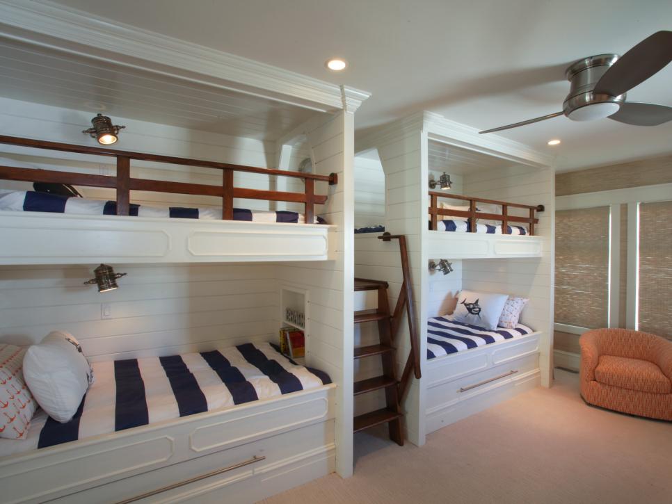 Blue and White Bunk Beds With Orange Chair in Kid-Friendly Room