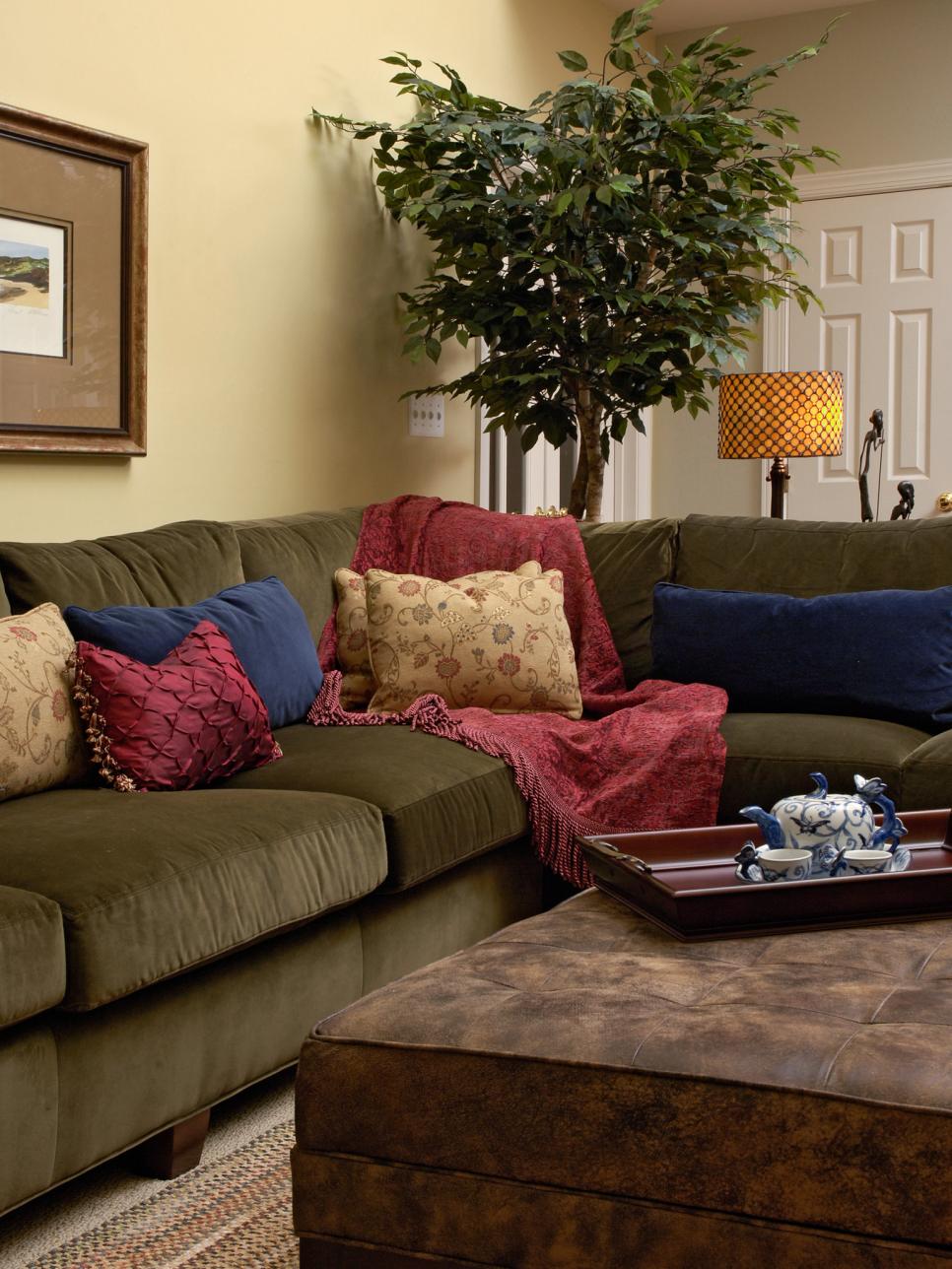 Family Room with Green Couch and Red and Blue Accent Pillows 