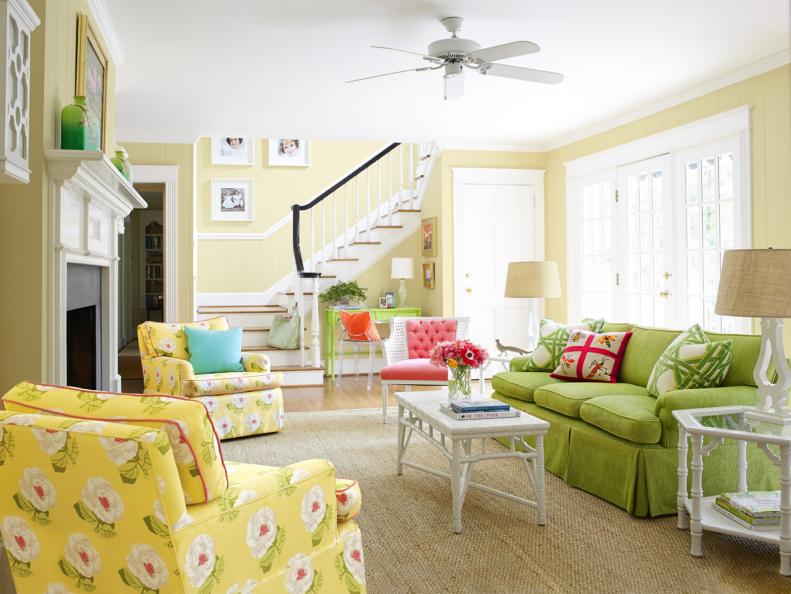 A Neutral Living Room With Green and Yellow Sofas. 