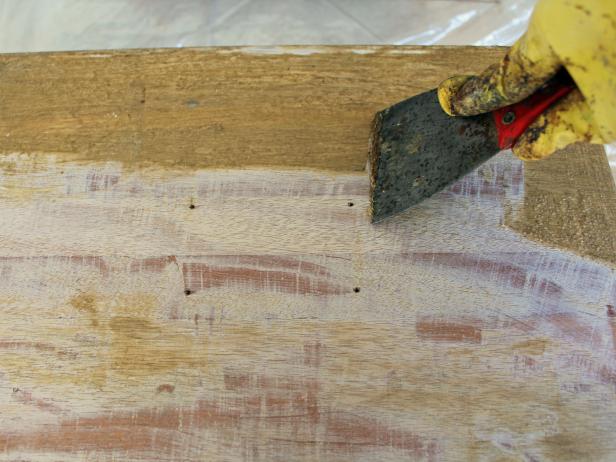 After applying chemical stripper, let sit, then scrape off existing finish. Tip: Multiple applications of stripper may be necessary to completely remove the existing finish.