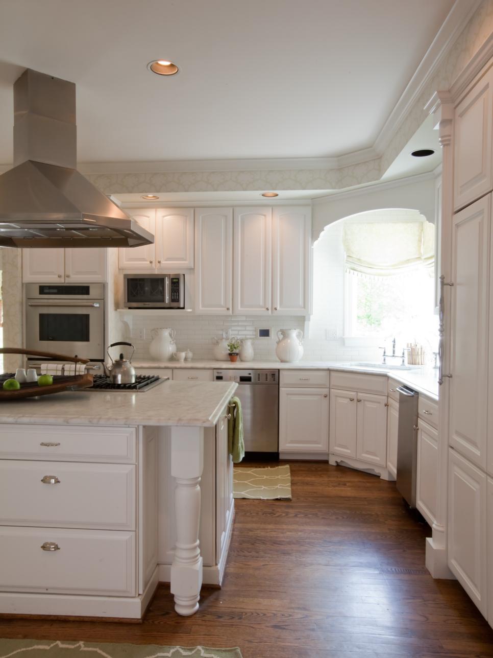 White Kitchen with Furniture-Style Cabinets and Stainless Steel Hood